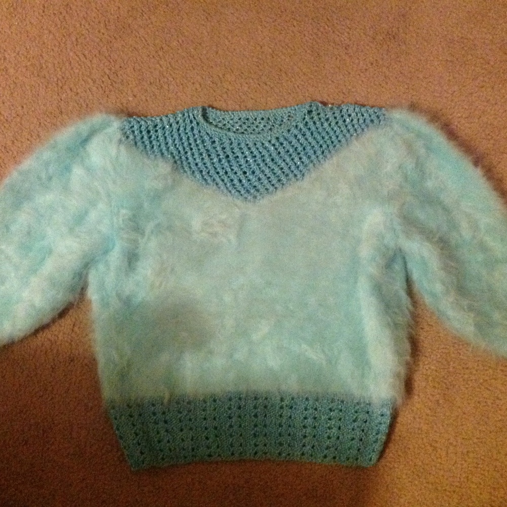 Hand Knit turquoise sweater.
